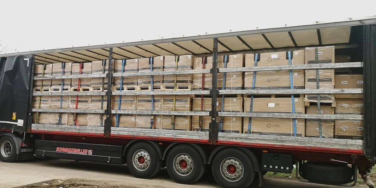Solis inverter container loading and shipping – 30kW hybrid inverters palletized and loaded for logistics transport, ensuring safe delivery to commercial installation sites
